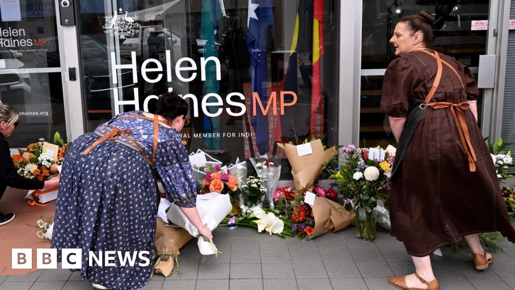 Man charged with attack on Australian MP as suspect's father says she is family friend